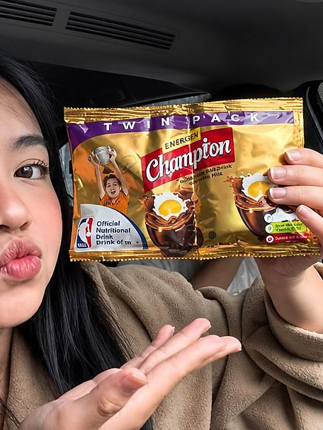 Creator holding an Energen Champion twin-pack in a car
